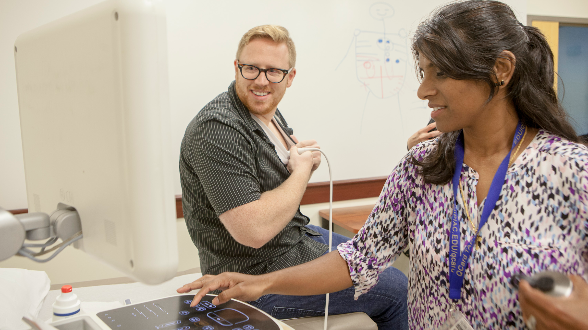 Dr. Professor Listy Thomas, right, instructs Cameron Harrison MD ’17 in sonogram techniques in the Center for Medicine, Nursing and Health Sciences. Thomas has been developing an interdisciplinary ultrasound curriculum with the School of Health Sciences.